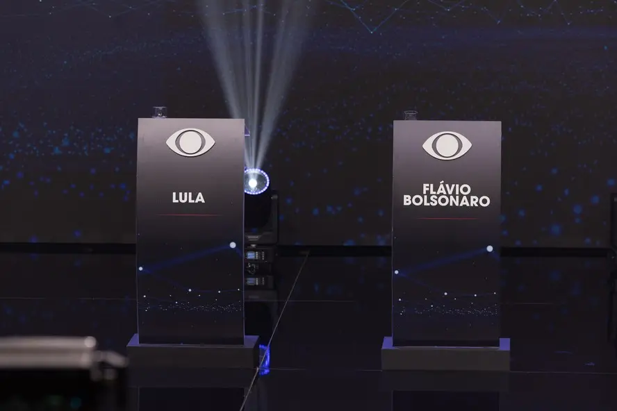 O domingo de Lula e Flávio Bolsonaro durante debate esvaziado na Band